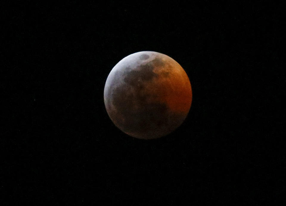 This photo shows the moon during a total lunar eclipse, seen from Los Angeles, Sunday Jan. 20, 2019. The entire eclipse will exceed three hours. Totality - when the moon's completely bathed in Earth's shadow - will last an hour. Expect the eclipsed, or blood moon, to turn red from sunlight scattering off Earth's atmosphere. (AP Photo/Ringo H.W. Chiu)