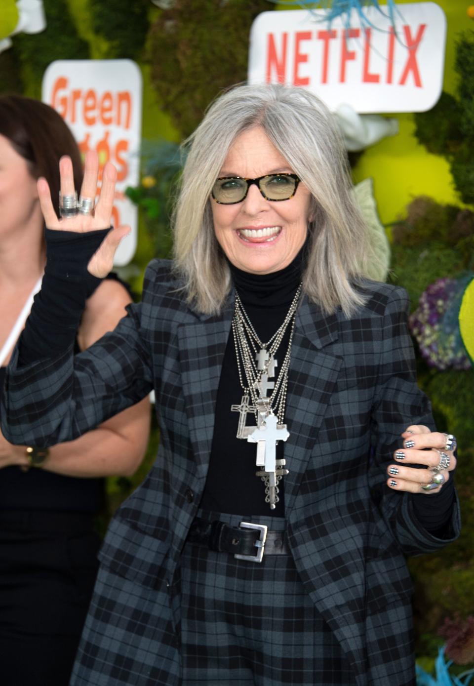 With white hair, smiling and waving at the Dr Seuss movie premiere