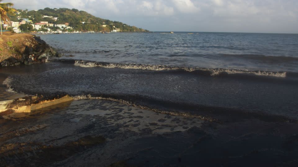 The oil spill, pictured on February 10, covered about 15 kilometers (about 9 miles) of the coastline in black residue. - Clement Williams/AFP/Getty Images