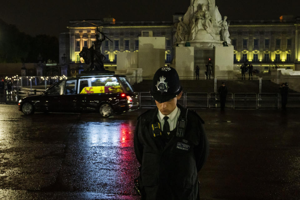 The cortege carrying the coffin of late Queen Elizabeth II, arrives at Buckingham Palace in London, Tuesday, Sept. 13, 2022. Because she reigned and lived for so long, Queen Elizabeth II's death was a reminder that mortality and the march of time are inexorable. (AP Photo/Nariman El-Mofty)