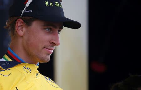 Cycling - Tour de France cycling race - The 183-km (113 miles) Stage 2 from Saint-Lo to Cherbourg-en-Cotentin, France - 03/07/2016 - Yellow jersey leader Tinkoff rider Peter Sagan of Slovakia reacts on the podium. REUTERS/Juan Medina