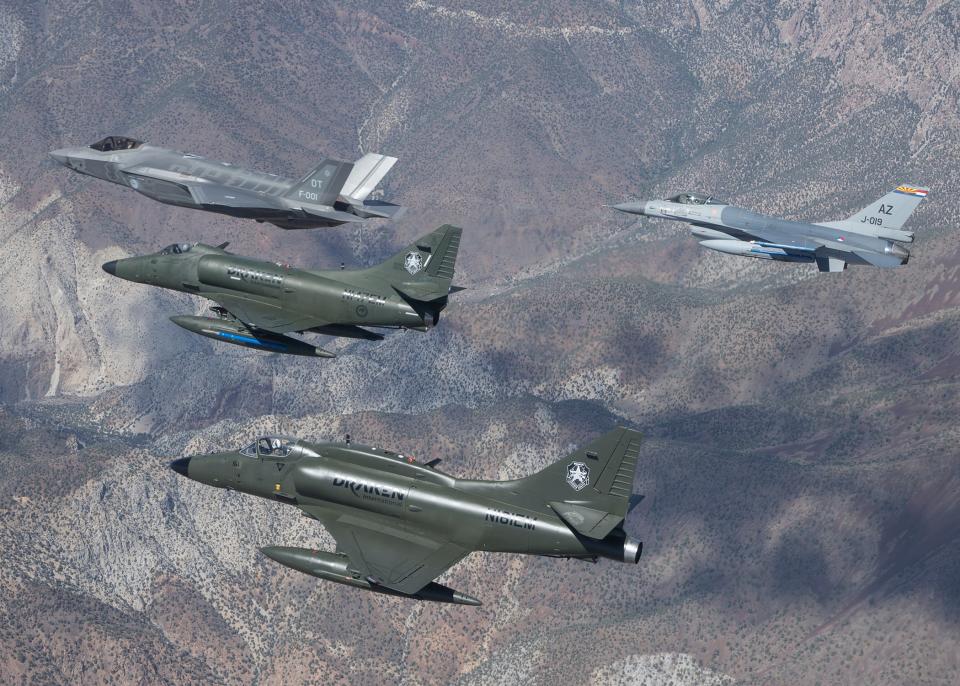 A Dutch F-35A, a Dutch F-16, and a pair of Draken International A-4 Skyhawks fly in support of an operational test exercise for the Royal Netherlands Air Force contingent at Edwards Air Force Base, California. <em>Photo courtesy Frank Crebas</em><br>