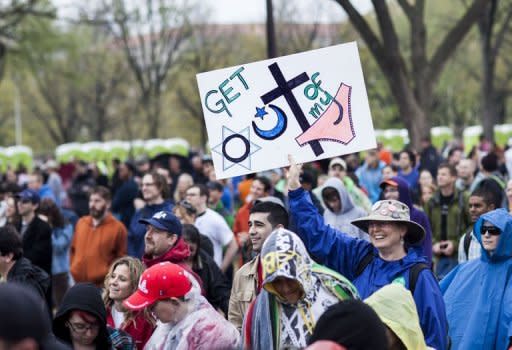 People gather for the Reason Rally on the National Mall in Washington, DC. Thousands of atheists, agnostics and other non-believers turned out in the US capital on Saturday to celebrate their rejection of the idea of God and to claim a bigger place in public life