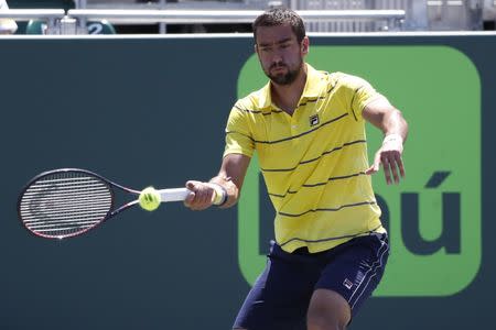 Mar 25, 2018; Key Biscayne, FL, USA; Marin Cilic of Croatia hits a forehand against Vasek Pospisil of Canada (not pictured) on day six of the Miami Open at Tennis Center at Crandon Park. Cilic won 7-5. 7-6(4). Geoff Burke-USA TODAY Sports