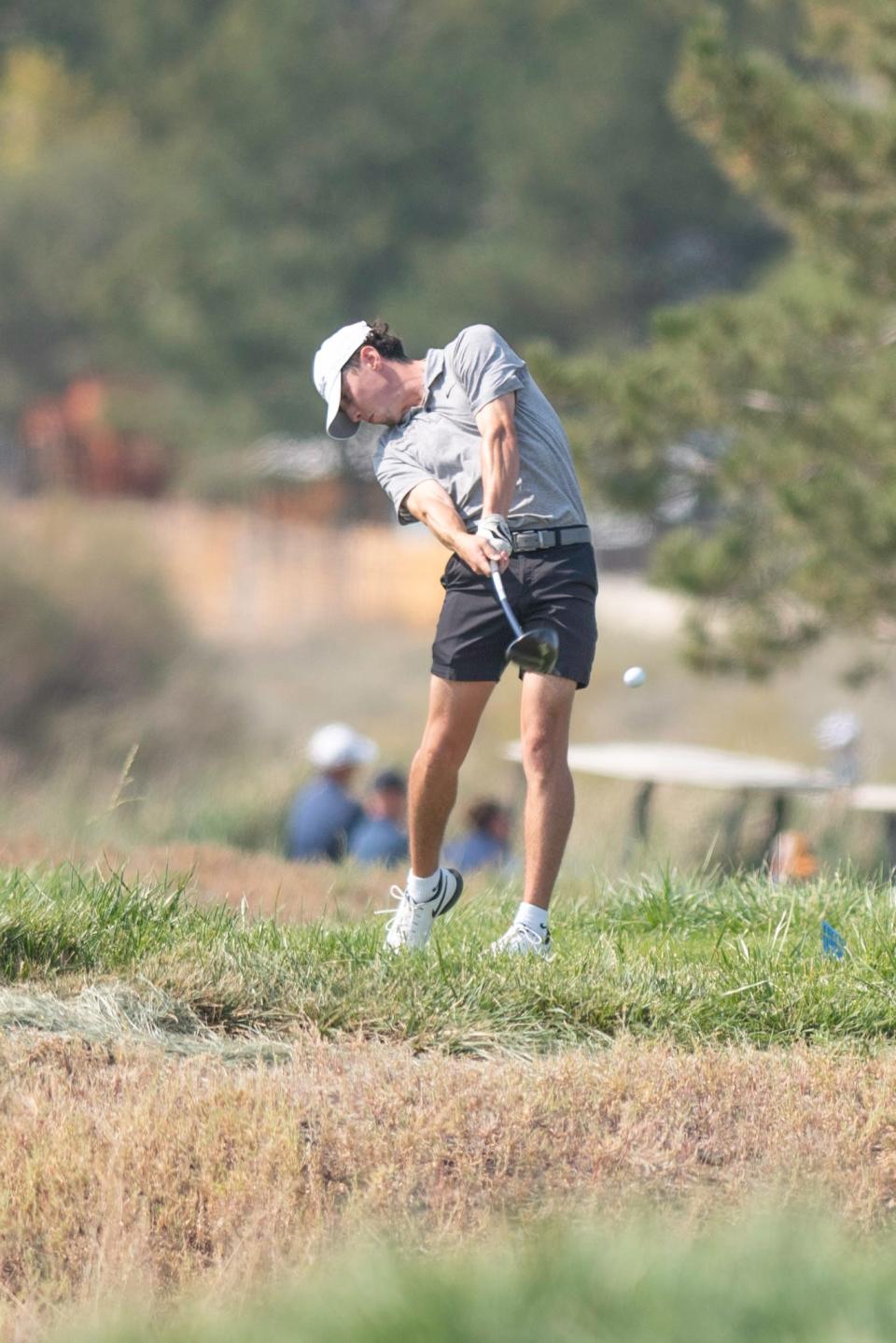 Pueblo East's Jayden Padilla tees off at the 18th hole at Walking Stick Golf Course during the state tournament on Tuesday, October 8, 2024.