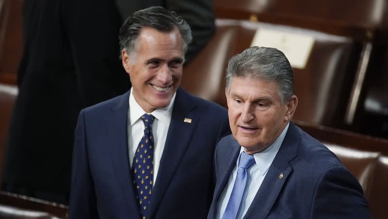Sen. Joe Manchin, D-W.Va., right, and Sen. Mitt Romney, R- Utah, arrive to hear President Joe Biden deliver his State of the Union address to a joint session of Congress at the Capitol on March 1, 2022, in Washington. A group is working to persuade the two lawmakers to join forces in a third-party presidential bid in 2024.