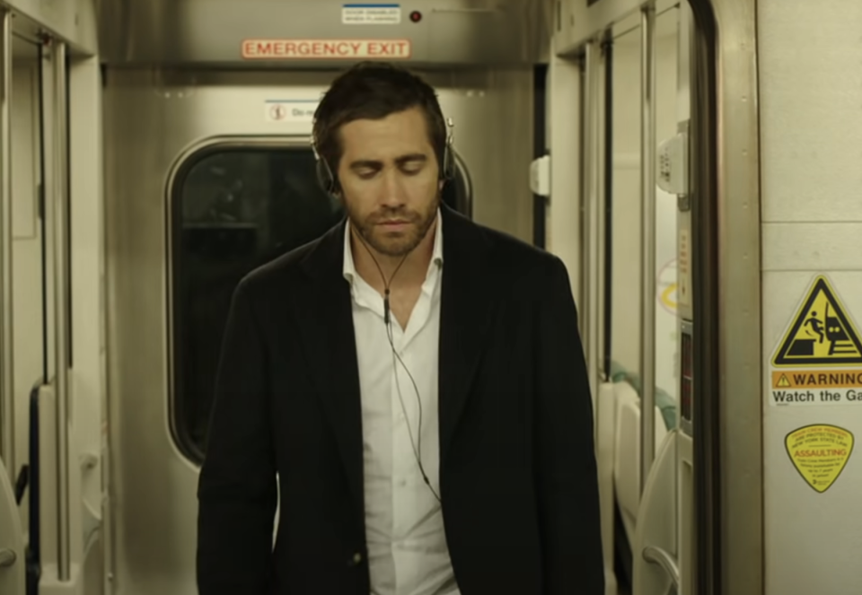 Closeup of Jacob Gyllenhaal on a train