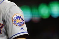 FILE - In this Sept. 3, 2019, file photo, the New York Mets logo is seen on Brandon Nimmo's sleeve as he prepares for an at-bat during a baseball game against the Washington Nationals in Washington. Major League Baseball owners voted Friday, Oct. 30, 2020, to approve the sale of the New York Mets to billionaire hedge fund manager Steve Cohen. The sale from the Wilpon and Katz families values the franchise at between $2.4 billion and $2.45 billion, a record for a baseball team. The sale is likely to close within 10 days.(AP Photo/Patrick Semansky, File)