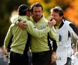MEDINAH, IL - SEPTEMBER 28: Rory McIlroy and Graeme McDowell of Europe celebrate on the fourth hole after McIlroy holed a chip shot for birdie during the Morning Foursome Matches for The 39th Ryder Cup at Medinah Country Club on September 28, 2012 in Medinah, Illinois. (Photo by Jamie Squire/Getty Images)