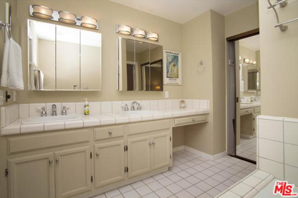 <p>The master’s ensuite bathroom is spacious and has a double-vanity sink. (Trulia.com) </p>