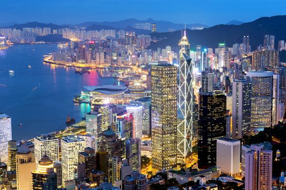 Take in Hong Kong’s buzzing nightlife in clement temperatures (Getty/iStockphoto)