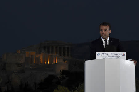 French President Emmanuel Macron delivers a speech atop the Pnyx Hill as the Acropolis hill with the ancient Parthenon temple is seen in the background in Athens, Greece, September 7, 2017. REUTERS/Aris Messinis/Pool -