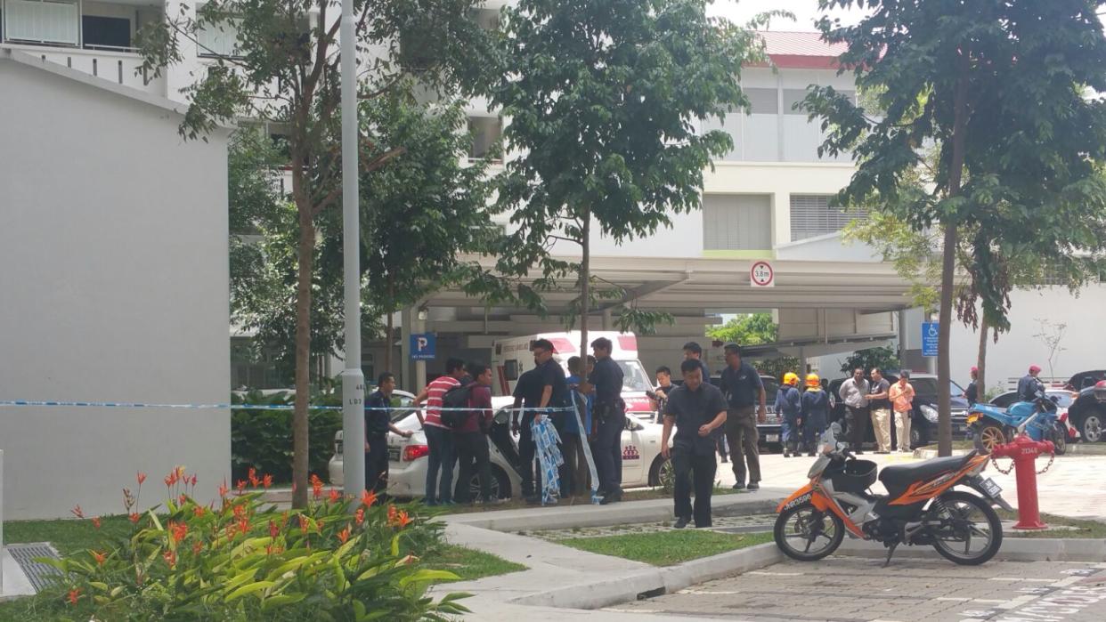 Police officers seen at the Sembawang Drive HDB block where the incident took place. (Yahoo News Singapore file photo)