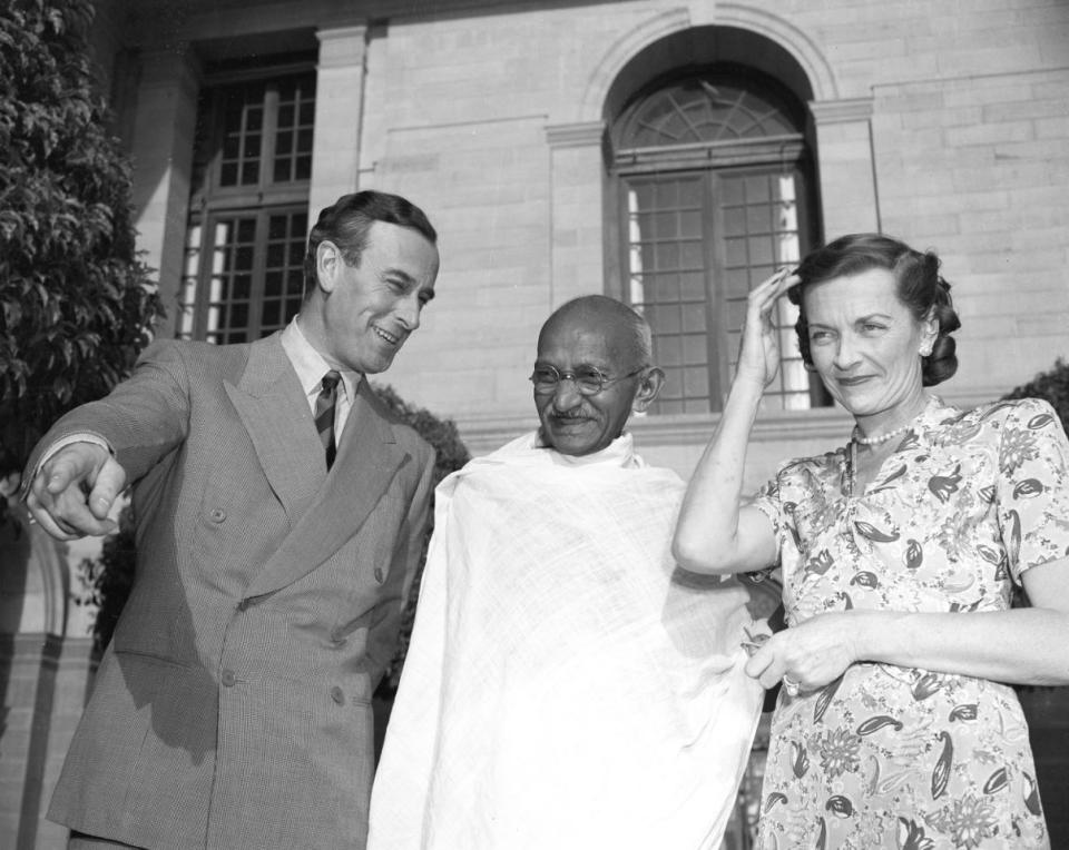 LORD LADY MOUNTBATTEN WITH MAHATMA GANDHI: Lord and Lady Mountbatten are seen with Mahatma Gandhi, center, in the garden of the Viceregal lodge in New Delhi, India, March 31, 1947.  Lord Mountbatten, the last viceroy of India, and Gandhi discuss points in the transfer of government from British to Indian rule. (AP Photo)