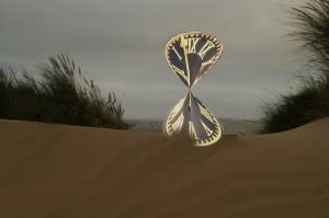 Clock twisted into an hourglass