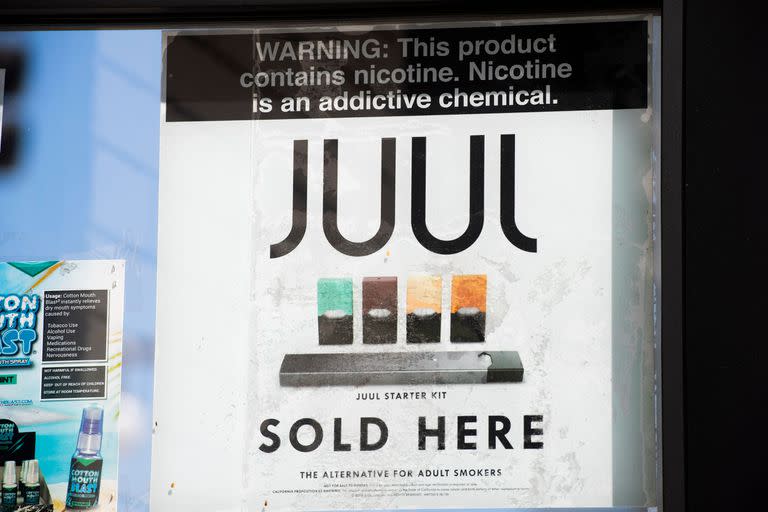 (FILES) In this file photo taken on September 17, 2019 a sign advertises Juul vaping products in Los Angeles, California. - The US Food and Drug Administration on June 23, 2022 said it was ordering all vaping products produced by Juul Labs off the market after finding the former industry leader had failed to address certain safety concerns. (Photo by Robyn Beck / AFP)