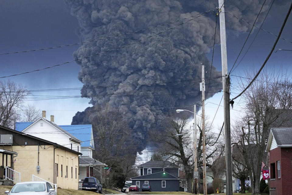 A large plume of smoke rises over East Palestine, Ohio, after a controlled detonation of a portion of a derailed Norfolk Southern train on Feb. 6, 2023. Three days earlier, about 50 cars, including 10 carrying hazardous materials, derailed in a fiery crash. (AP Photo/Gene J. Puskar)