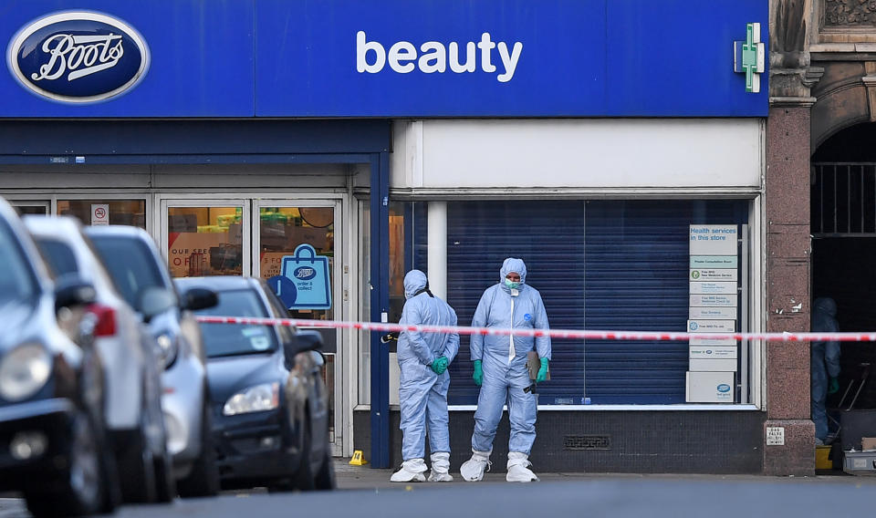 Police forensic officers work outside of a Boots store on Streatham High Road in south London on February 3, 2020, after a man was shot dead by police on February 2, following reports he had stabbed two people. - A man wearing a "hoax device" shot dead by police in London Sunday after stabbing two people had recently been released from prison for previous terrorism offences, British media reported. The suspect, Sudesh Amman, was released last month after serving around half of an approximate three-year sentence for disseminating terrorist material, according to multiple reports. (Photo by DANIEL LEAL-OLIVAS / AFP) (Photo by DANIEL LEAL-OLIVAS/AFP via Getty Images)