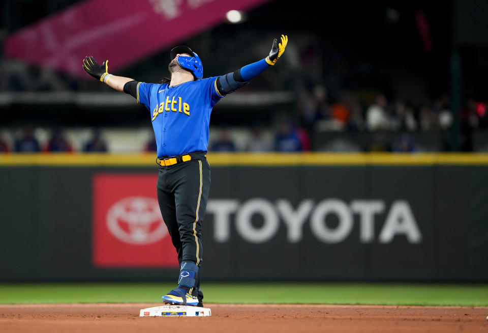 Seattle Mariners' Eugenio Suárez celebrates after his RBI double against the Texas Rangers during the third inning of a baseball game Friday, Sept. 29, 2023, in Seattle. (AP Photo/Lindsey Wasson)