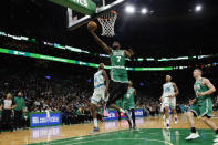 Boston Celtics' Jaylen Brown goes to the basket past Charlotte Hornets' Jalen McDaniels during the second quarter of an NBA basketball game Wednesday, Jan. 19, 2022, in Boston. (AP Photo/Winslow Townson)