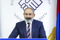 Armenian acting Prime Minister Nikol Pashinyan speaks to his party colleagues after parliamentary elections in Yerevan, Armenia, Monday, June 21, 2021. Results released Monday showed the party of Pashinyan won the snap parliamentary elections he called to ease anger over a peace deal he signed with Azerbaijan. (Tigran Mehrabyan/PAN Photo via AP)