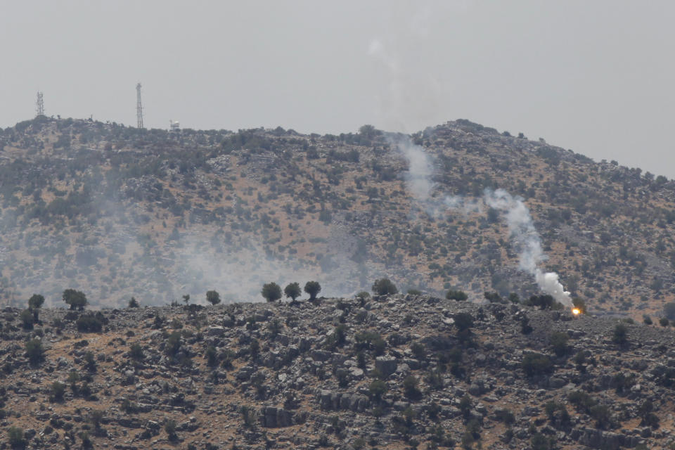 Smoke rise from Israeli shelling near the southern Lebanese village of Kfar Shouba, after Hezbollah fired rockets near an Israeli positions the Golan Heights, Friday, Aug. 6, 2021. The militant Hezbollah group said it fired a barrage of rockets near Israeli positions close to the Lebanese border on Friday, calling it retaliation for Israeli airstrikes on southern Lebanon a day earlier. (AP Photo/Mohammed Zaatari)