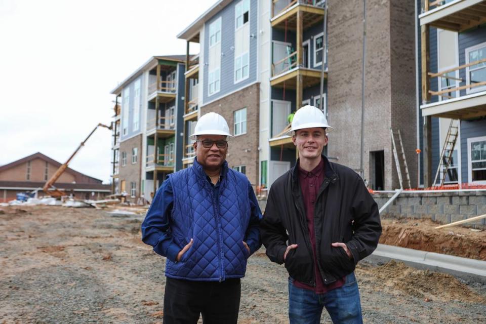 Rev. Peter Wherry, senior pastor of Mayfield Memorial Baptist Church, left, and Merritt McCully, a Hidden Valley resident and executive director of Mayfield Memory Community Development Corporation, stand in front of Sugaree Place, a new affordable housing complex near Hidden Valley that’s expected to open in June. Mayfield Memorial Baptist Church provided the land to establish this housing complex, which adjacent to the church on Sugar Creek Road.