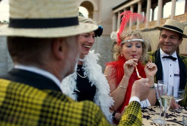 Time to party like it’s 1920? Revellers in Potsdam, Germany, outside Berlin, celebrate in 2009 in the fashion of the Roaring Twenties. New data out this week suggests that, just like following the 1918 flu pandemic, the Canadian economy is heading for a period of economic, social and artistic innovation. (Thomas Peter/Reuters - image credit)