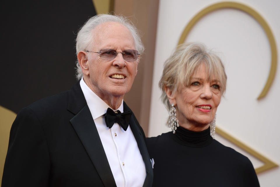 Bruce Dern, left, and Andrea Beckett arrive at the Oscars on Sunday, March 2, 2014, at the Dolby Theatre in Los Angeles. (Photo by Jordan Strauss/Invision/AP)