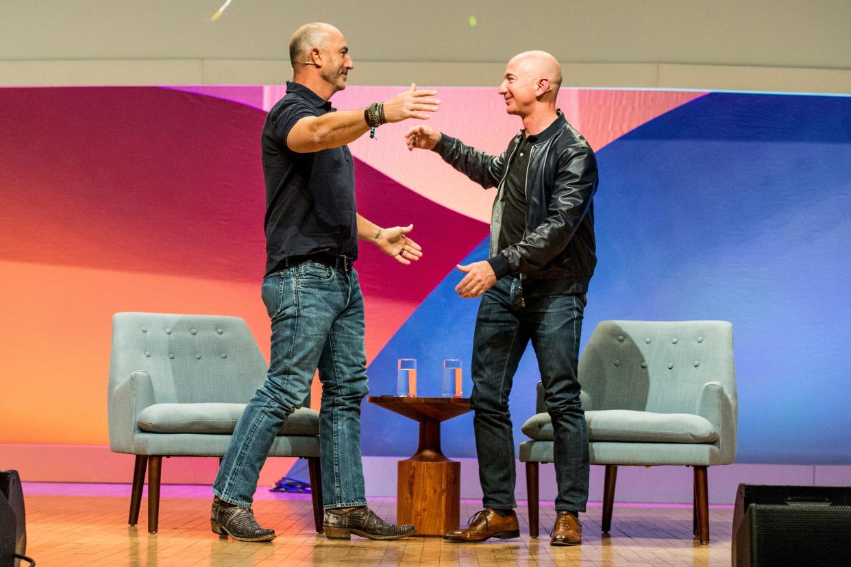 Mark Bezos, left, has worked in marketing, as an executive at the nonprofit Robin Hood Foundation and served as a volunteer firefighter.