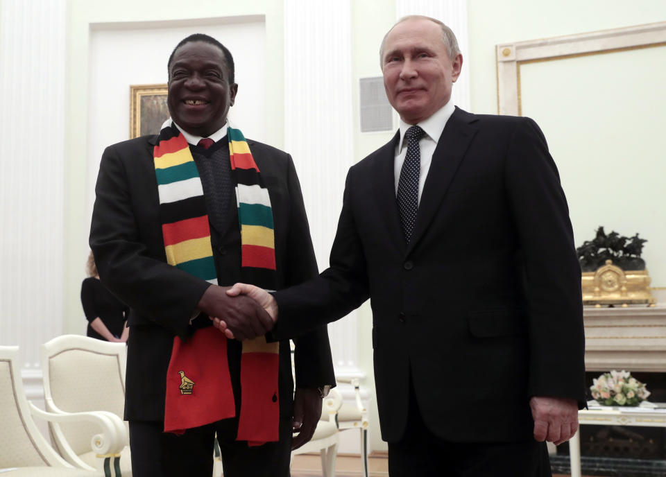 Russian President Vladimir Putin, right, and Zimbabwe's President Emmerson Dambudzo Mnangagwa shake hands during their meeting in Moscow, Russia, Tuesday, Jan. 15, 2019. (Sergei Chirikov/Pool Photo via AP)