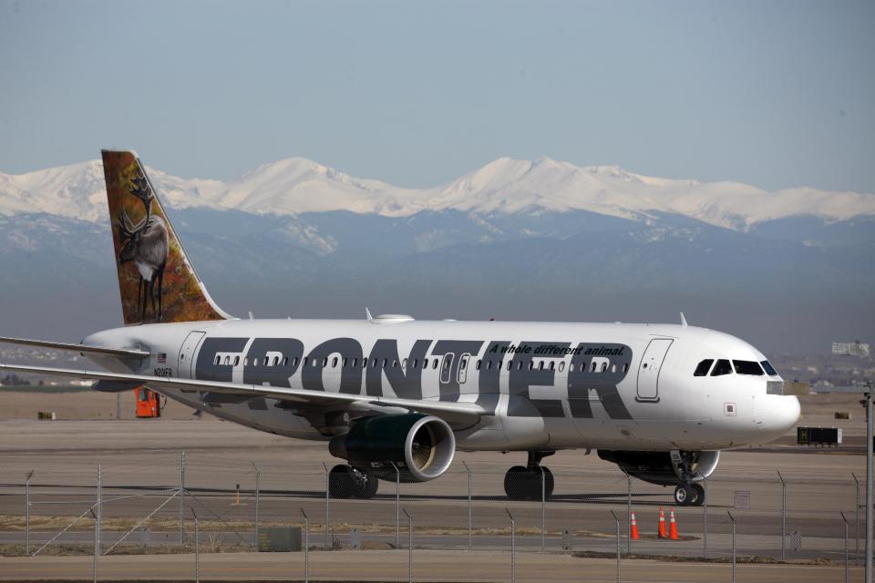 FILE - In this Thursday, April 8, 2010 file photo, a Frontier Airlines jetliner arrives at Denver International Airport. Carriers are offering more deals to passengers who book flights directly on their websites. Frontier Airlines is the latest carrier to jump into the fight, announcing Wednesday, Sept. 12, 2012, that it will penalize passengers who don’t book directly with the airline. (AP Photo/David Zalubowski, File)