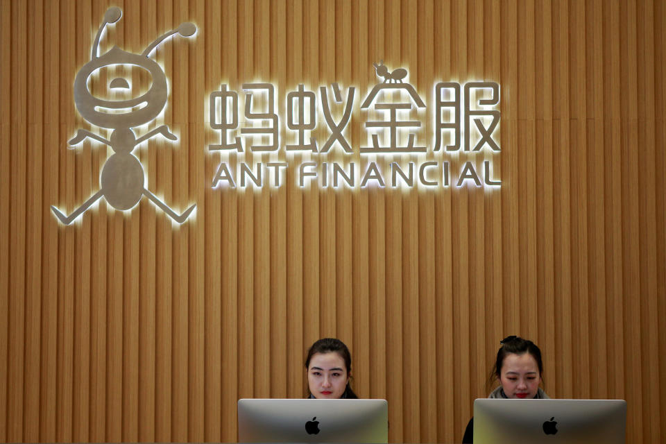 FILE PHOTO: Employees are seen at the reception desk of Ant Financial Services Group at its headquarters in Hangzhou