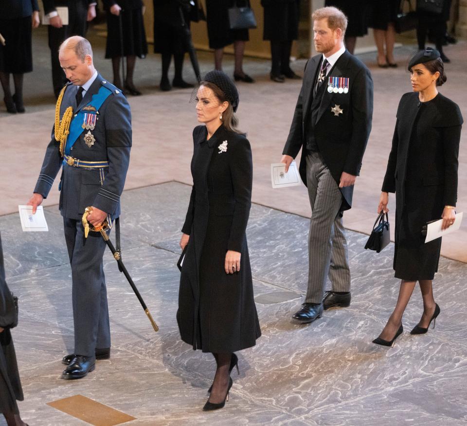 Prince William, Prince of Wales, Catherine, Princess of Wales, Harry, Duke of Sussex and Meghan, Duchess of Sussex arrive as the coffin bearing the body of Queen Elizabeth II completes its journey from Buckingham Palace to Westminster Hall accompanied by King Charles III and other members of the Royal Family, on Sept. 14, 2022 in London.