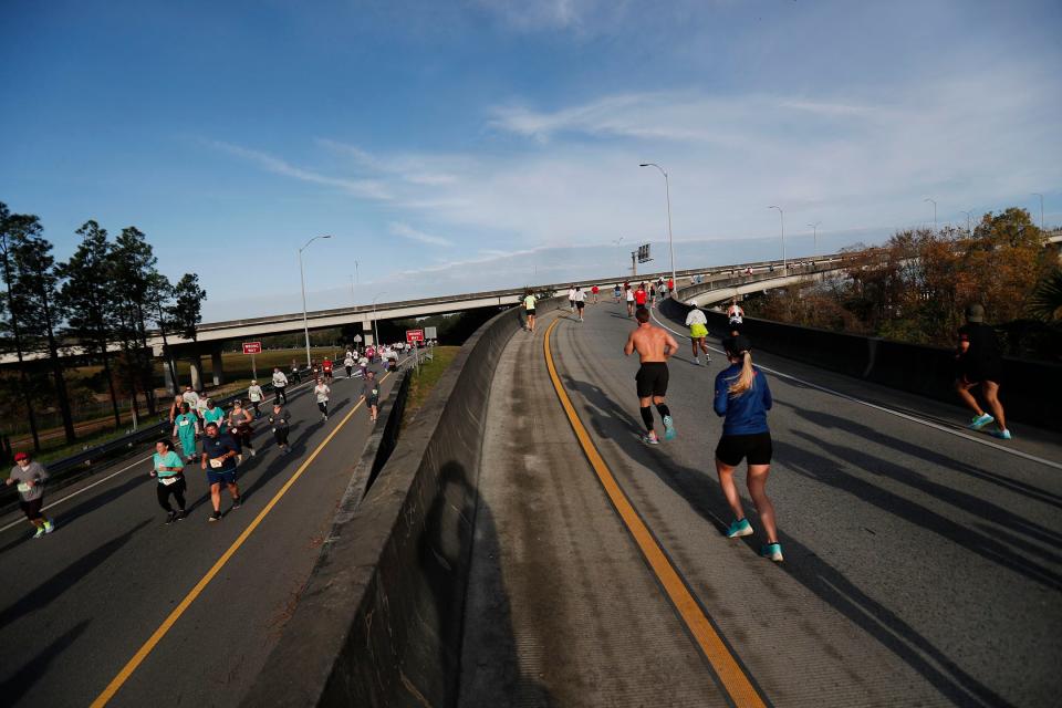 5K runners head toward the finish line while 10k and Double Pump participants head up the ramp for the Talmadge Bridge on Saturday December 3, 2022 during the annual enmarket Savannah Bridge Run.