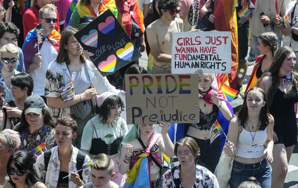 Participants of the Cologne Pride rally march through the city center in Cologne, Germany, Sunday, July 3, 2022. This year's Christopher Street Day (CSD) Gay Parade with thousands of demonstrators for LGBTQ rights is the first after the coronavirus pandemic to be followed by hundreds of thousands of spectators in the streets of Cologne. (AP Photo/Martin Meissner)