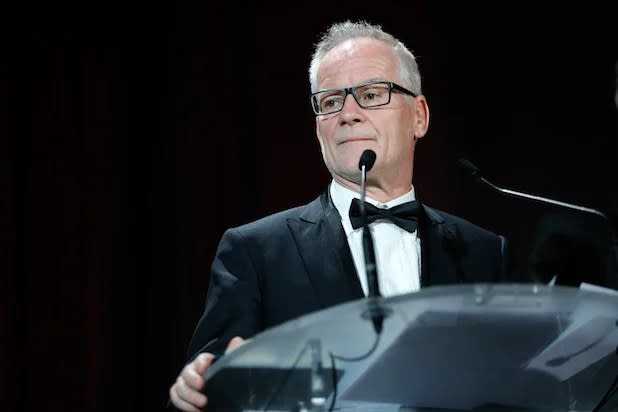 Cannes Film Festival chief Thierry Fremaux in a black tux on stage at the event