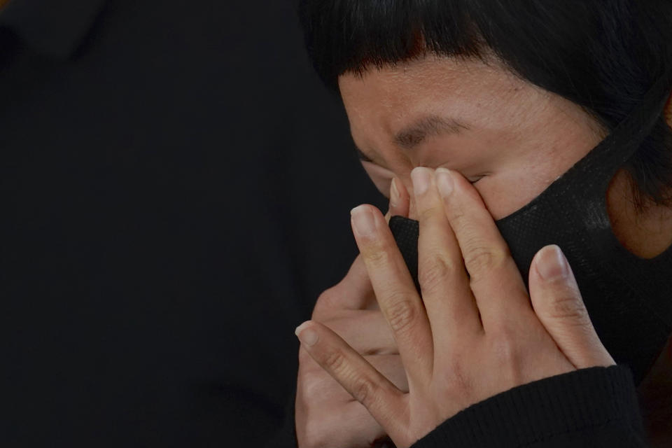 Hong Kong journalist Choy Yuk-ling, also known as Bao Choy, reacts outside a court in Hong Kong Thursday, April 22, 2021. A Hong Kong journalist was fined 6,000 Hong Kong dollars ($775) on Thursday after being found guilty of making false statements while obtaining information from a vehicle database, in the latest blow to press freedom in the city as authorities continue their crackdown on dissent. (AP Photo/Kin Cheung)