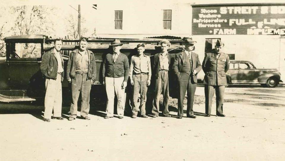 Members of the Polk Fire Department in 1944 were William Hoffman, left, Chief Stanley Miller, Postmaster Glen Swartz, Stanley Miller Jr. (age 17), Wayne Hoffman (age 16), Cliff Irwin and Sgt. Burl Irwin.