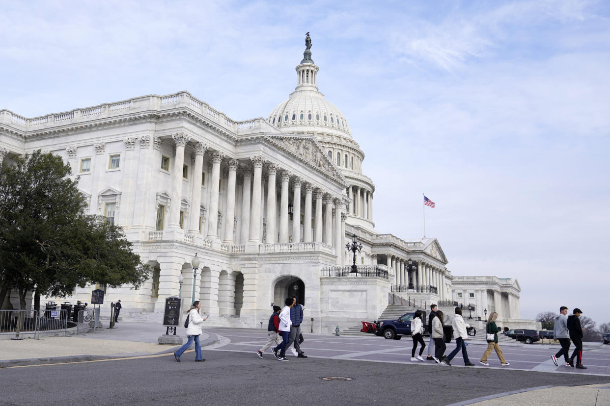 Visitors walk on the Capitol grounds, Tuesday morning, March 1, 2022, in Washington. President Joe Biden will deliver his first State of the Union address at a precipitous moment for the nation. Biden is aiming to navigate the country out of a pandemic, reboot his stalled domestic agenda and confront Russia's aggression. (AP Photo/Mariam Zuhaib)