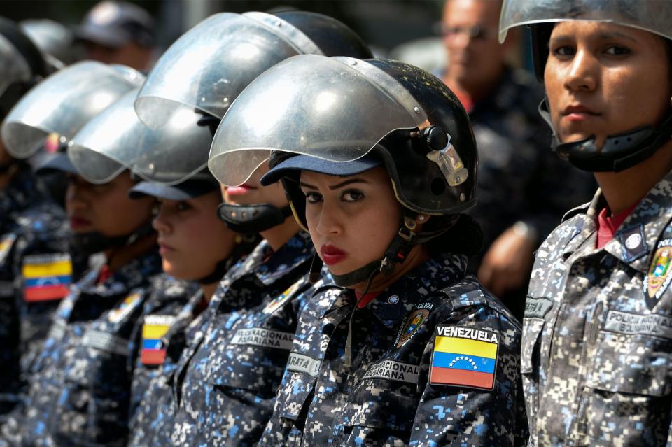Members of the Bolivarian National Police (PNB) stand guard near 'Dr. JM de los Rios' Children's Hospital in Caracas, during a protest against the government of President Nicolas Maduro and in demand of humanitarian aid, called by opposition leader and self-proclaimed 'acting president' Juan Guaido, on January 30, 2019. (Photo: FEDERICO PARRA/AFP/Getty Images) 