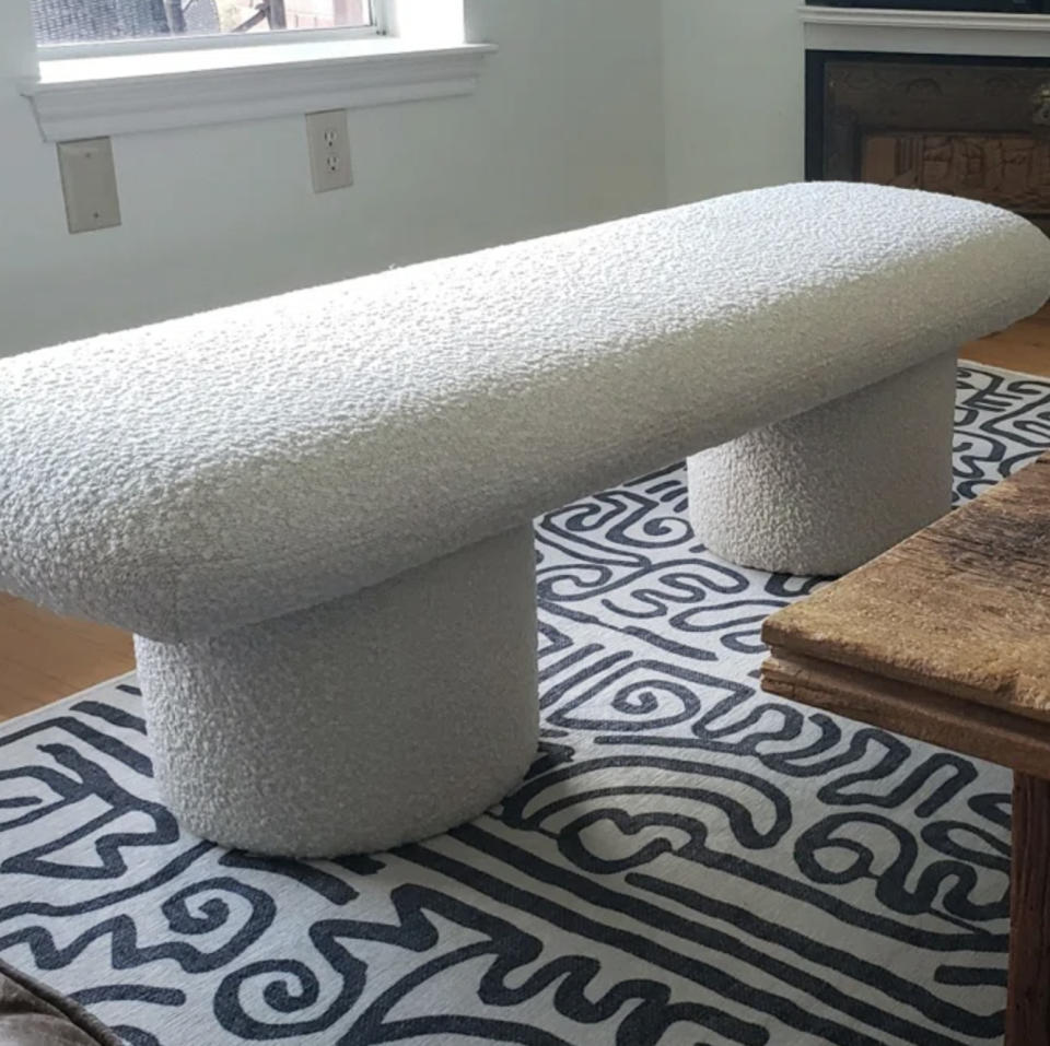 A white boucle bench