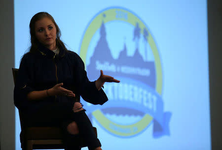 Millennial stock blogger and trader Rachel Fox, 20, speaks to a group of investors, tech nerds and stock traders at StockTwits annual Stocktoberfest in Coronado, California, U.S. October 14, 2016. Picture taken October 14, 2016. REUTERS/Mike Blake