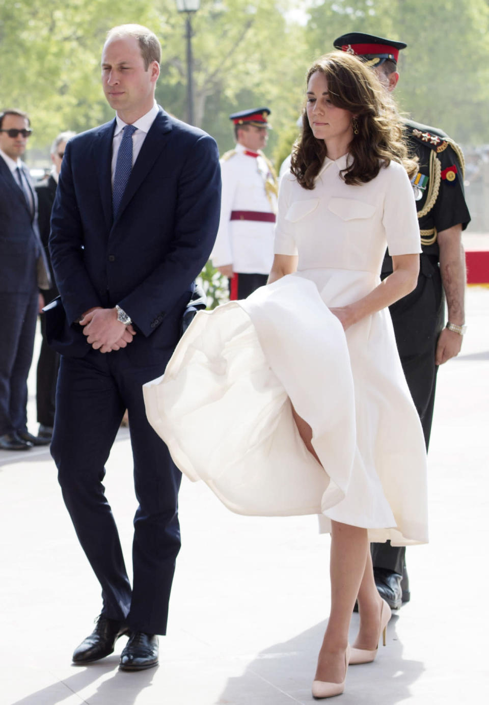<p>Even Kate experiences the odd wardrobe malfunction. While the Queen and Camilla tend to wear weighted skirts - to avoid this exact situation - the Duchess doesn’t tend to. <i>[Photo: Getty]</i></p>