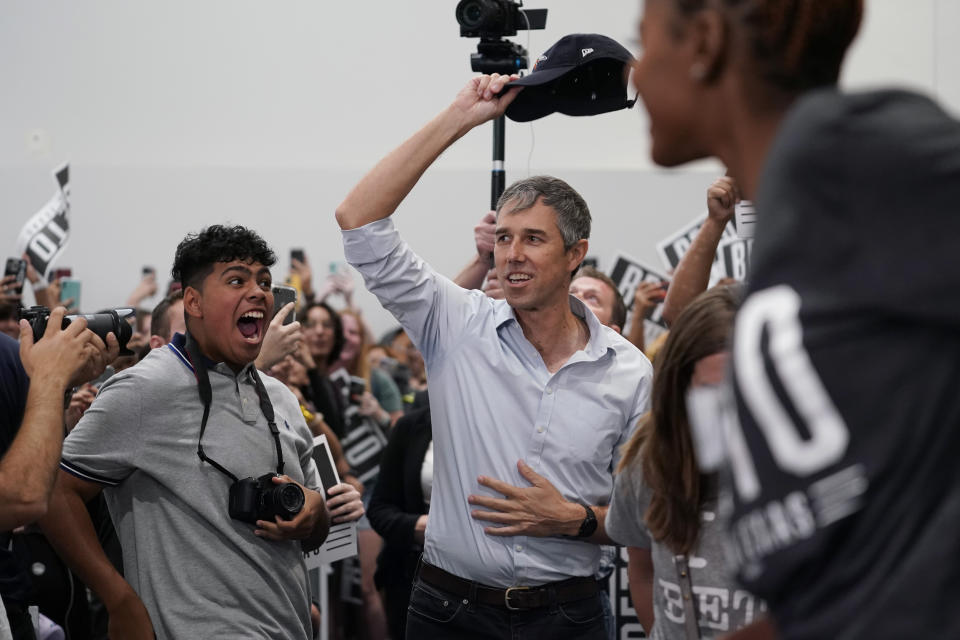 Texas Democratic gubernatorial candidate Beto O'Rourke, center, arrives for a rally at UTSA, Monday, Sept. 26, 2022, in San Antonio. O'Rourke is still trying to close in on Republican Gov. Greg Abbott with six weeks until Election Day. (AP Photo/Eric Gay)