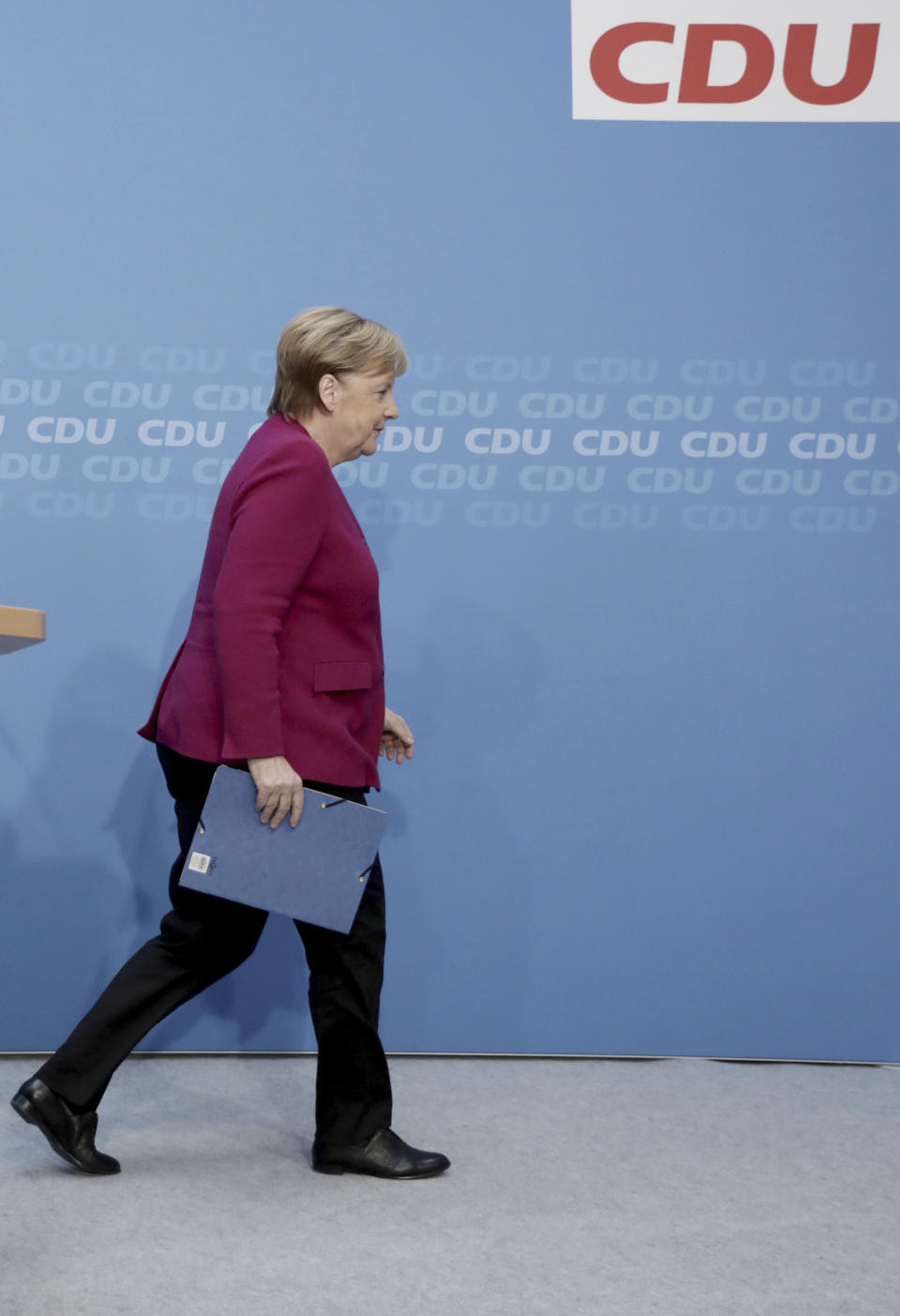 German Christian Democratic Party, CDU, chairwoman and Chancellor Angela Merkel leaves the podium after a news conference following a party's leaders meeting at the headquarters the in Berlin, Germany, Monday, Oct. 29, 2018. (Kay Nietfeld/dpa via AP)