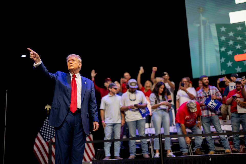 SAVANNAH, GEORGIA - SEPTEMBER 24: Republican presidential nominee, former U.S. President Donald Trump acknowledges the crowd at a campaign rally at the Johnny Mercer Theatre on September 24, 2024 in Savannah, Georgia. The former president spoke to attendees on various plans including the tax code, U.S. manufacturing, and future economic opportunities if reelected a second term. Trump continues campaigning around the country ahead of the November 6 presidential election.  (Photo by Brandon Bell/Getty Images)