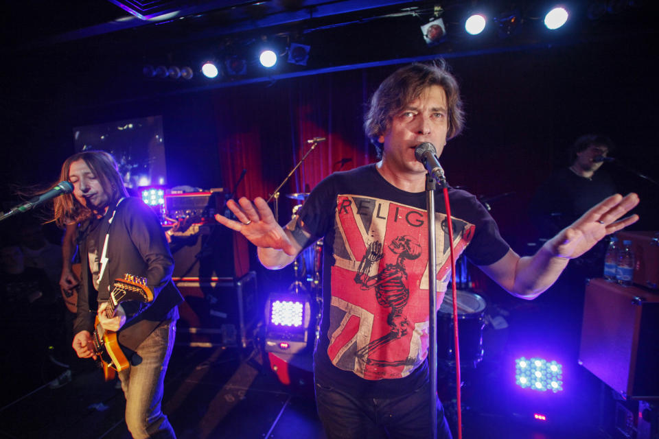 FILE - Aleksandr "Shura" Uman, left, and Yegor "Lyova" Bortnik perform during the Bi-2 rock band concert in Moscow, Russia, Thursday, Dec. 1, 2011. Members of a rock band that has been critical of Moscow’s war in Ukraine remain locked up in a Thai immigration jail, fearful that they could be deported to Russia as a reported plan to let them fly to safety in Israel was apparently suspended. (AP Photo/Pavel Golovkin, File)