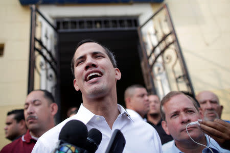 Venezuelan opposition leader Juan Guaido, who many nations have recognised as the country's rightful interim ruler, greets supporters after his visit to La Chiquinquira church in Maracaibo, Venezuela, April 13, 2019. REUTERS/Ueslei Marcelino