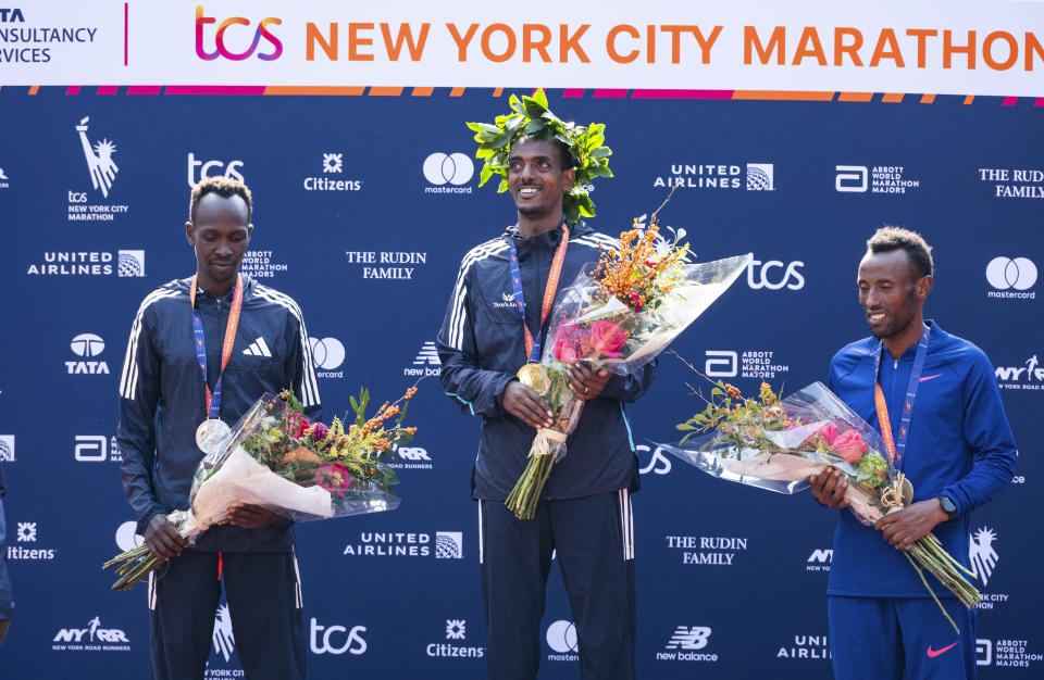 From left, second place finisher Albert Korir of Kenya, first place finisher Tamirat Tola, of Ethiopia, and third place finisher Shura Kitata, also from Ethiopia, pose after the men's division of the New York City Marathon, Sunday, Nov. 5, 2023, in New York.(AP Photo/Craig Ruttle)